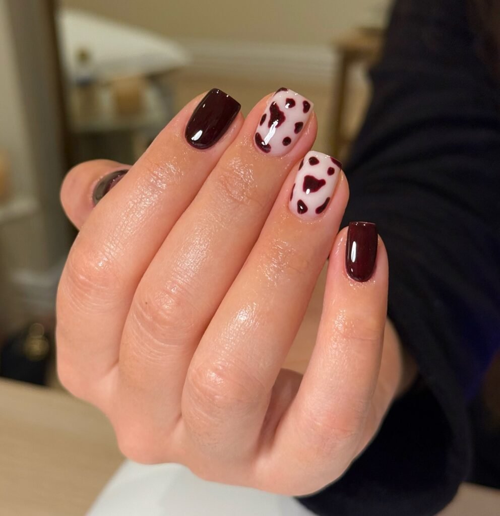 Dark Chocolate Cow Print Nails for a Moody Look