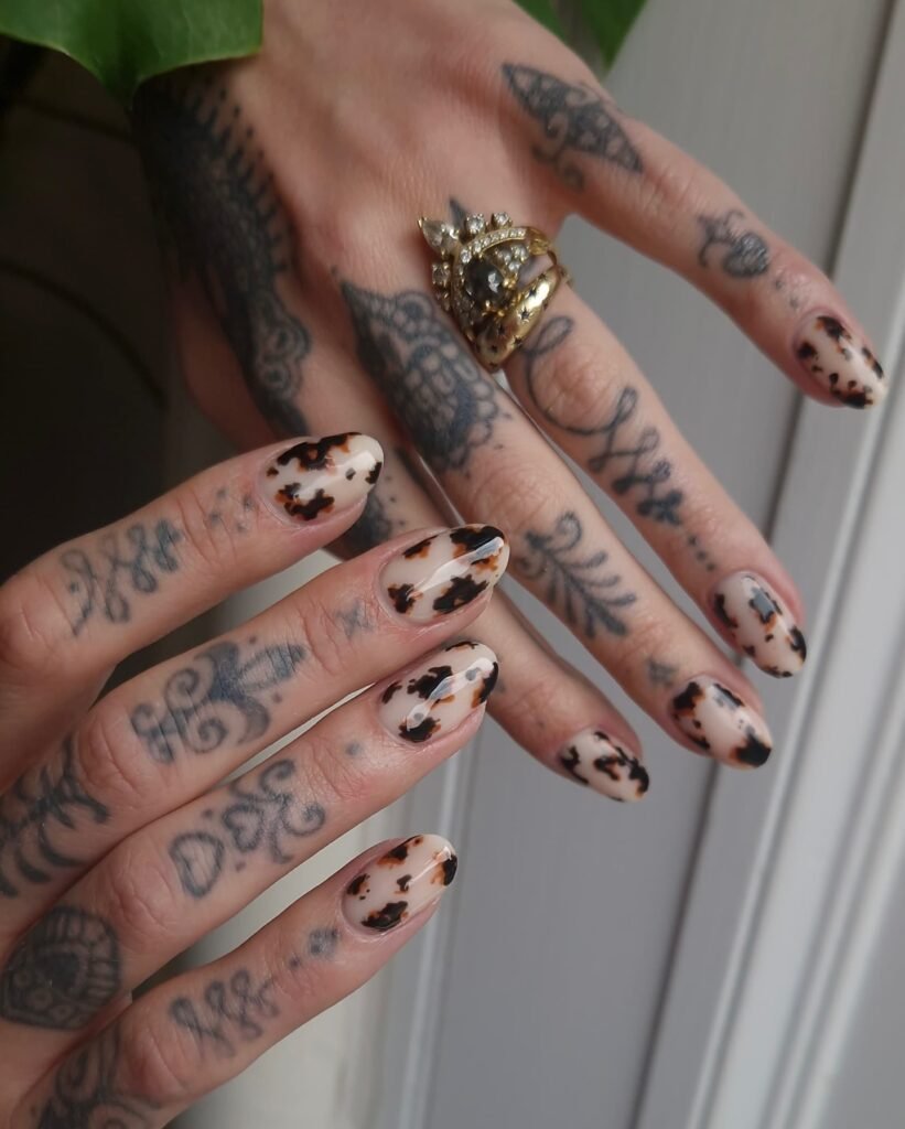Glossy Tortoise-Style Cow Print Almond Nails