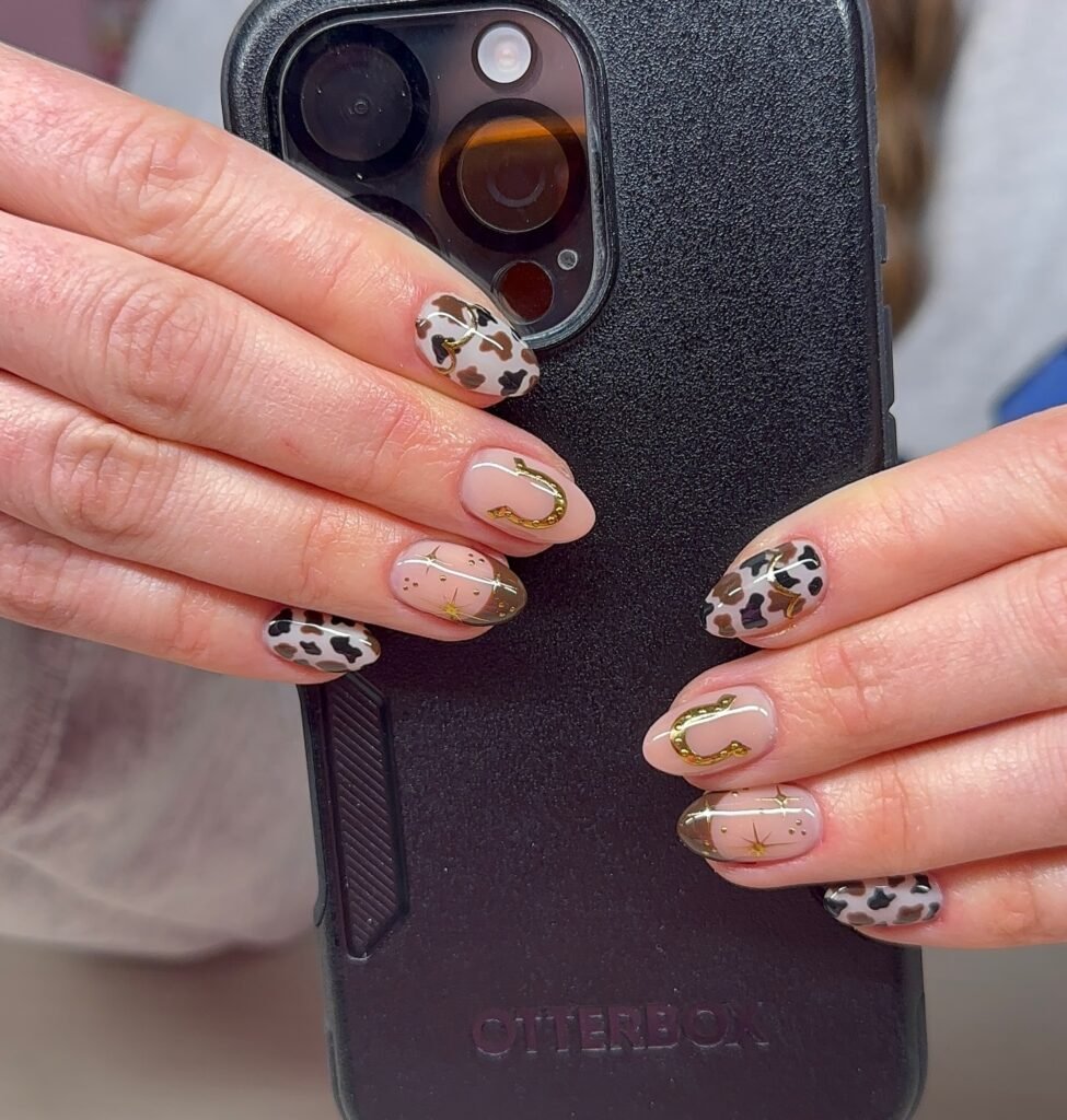 Gold Horseshoe Cow Print Nails with Neutral Tones