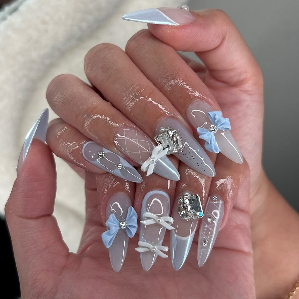Icy Blue Coquette Nails with Bows and Crystals