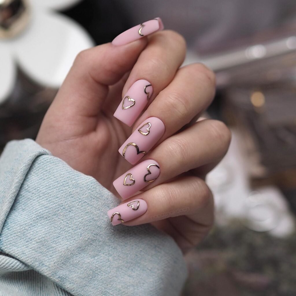 Matte Pink Nails With Gold Heart Outlines