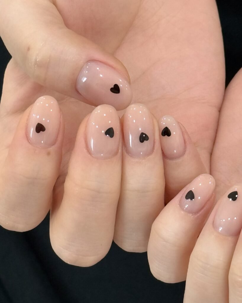 Nude Nails with Tiny Black Hearts