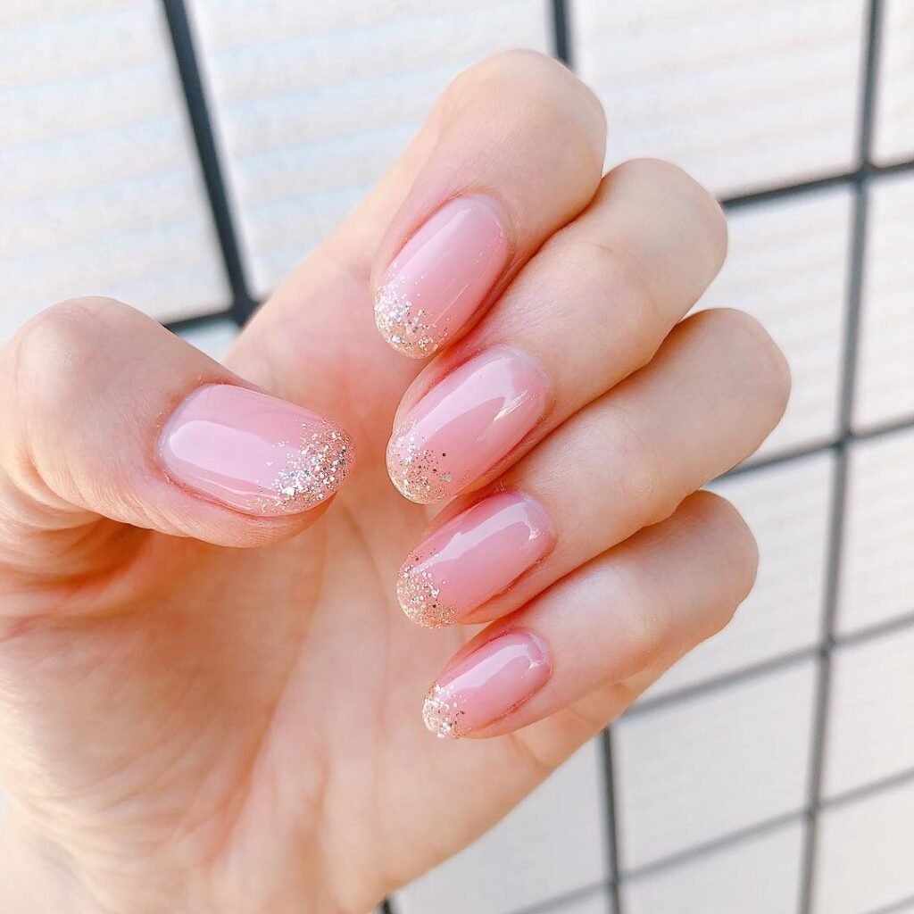 Pink Glossy Nails with Glitter French Tips
