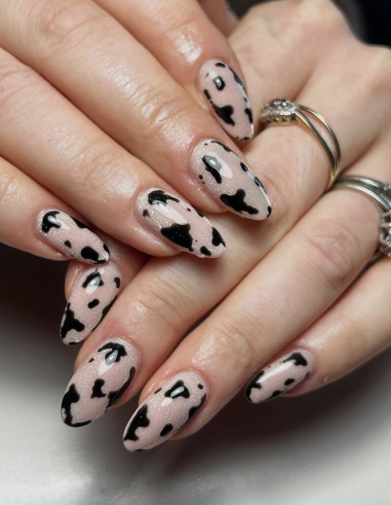Shimmery Nude Cow Print Almond Nails
