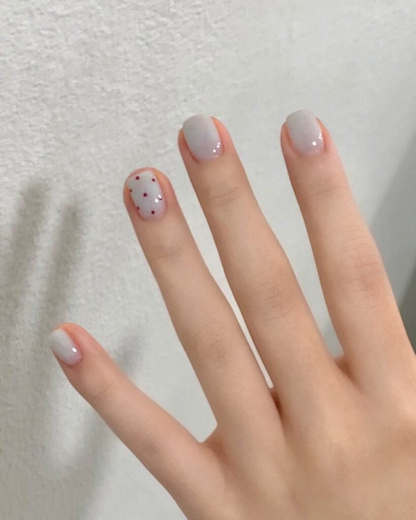 Short Grey Nails with Tiny Red Dot Accent