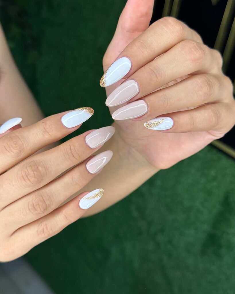 Soft Blue and Nude Almond Nails with Gold Glitter