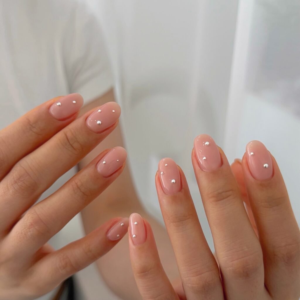 Soft Pink Nails with Minimal Silver Studs